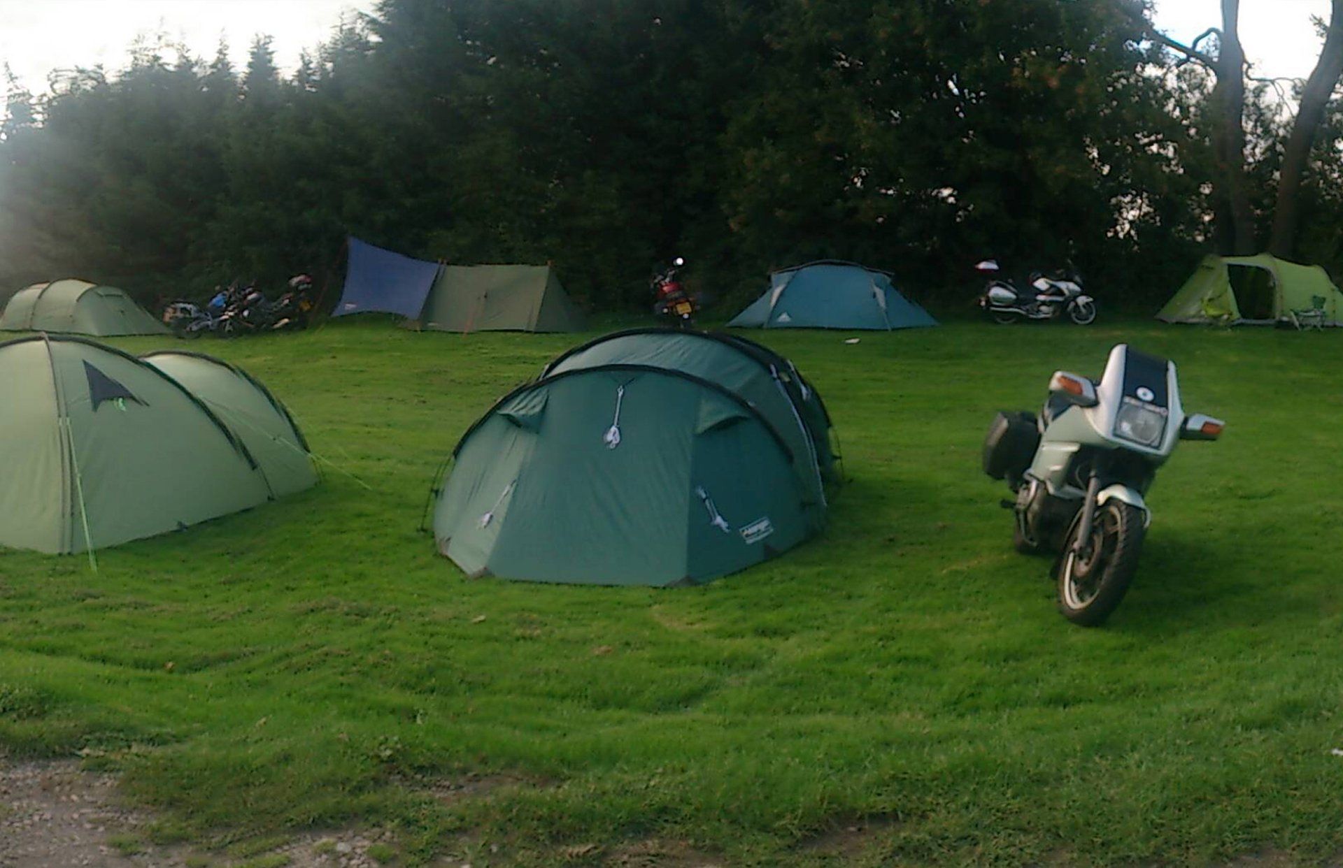 Rustic camping at the Lower Lode lawned riverside campsite near Tewkesbury, Gloucestershire