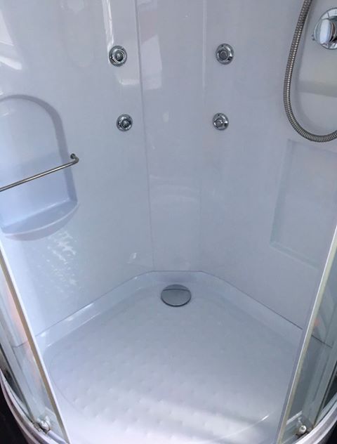 Spotless white shower cubicle after deep clean – sparkling bathroom service in Whitchurch, Shropshire