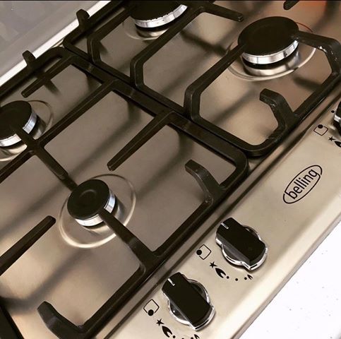 Deep cleaned stainless steel gas hob with polished finish – kitchen cleaning service in Whitchurch