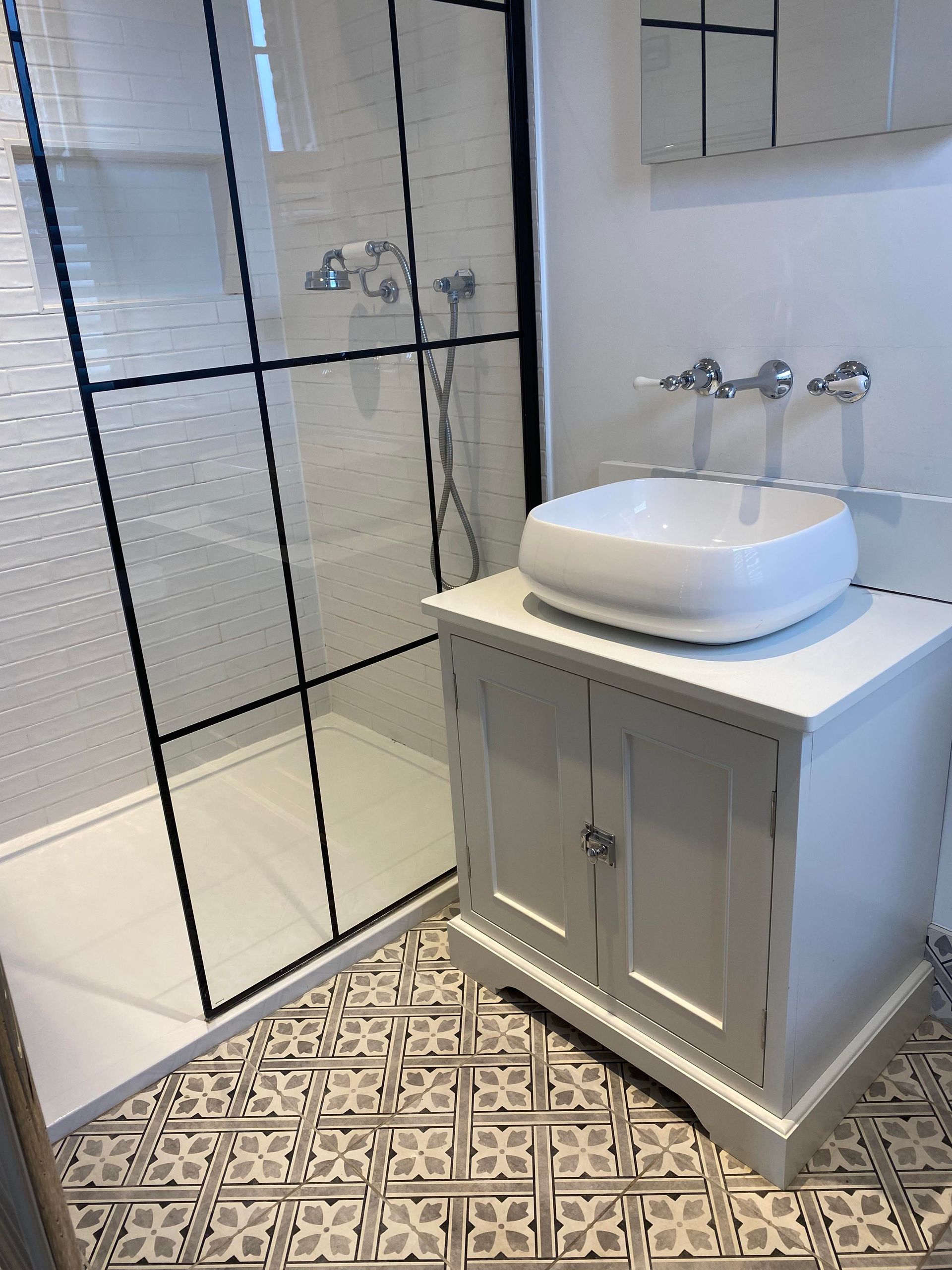 Immaculate bathroom clean with modern basin sink and black-framed shower screen – end of tenancy clean in Whitchurch