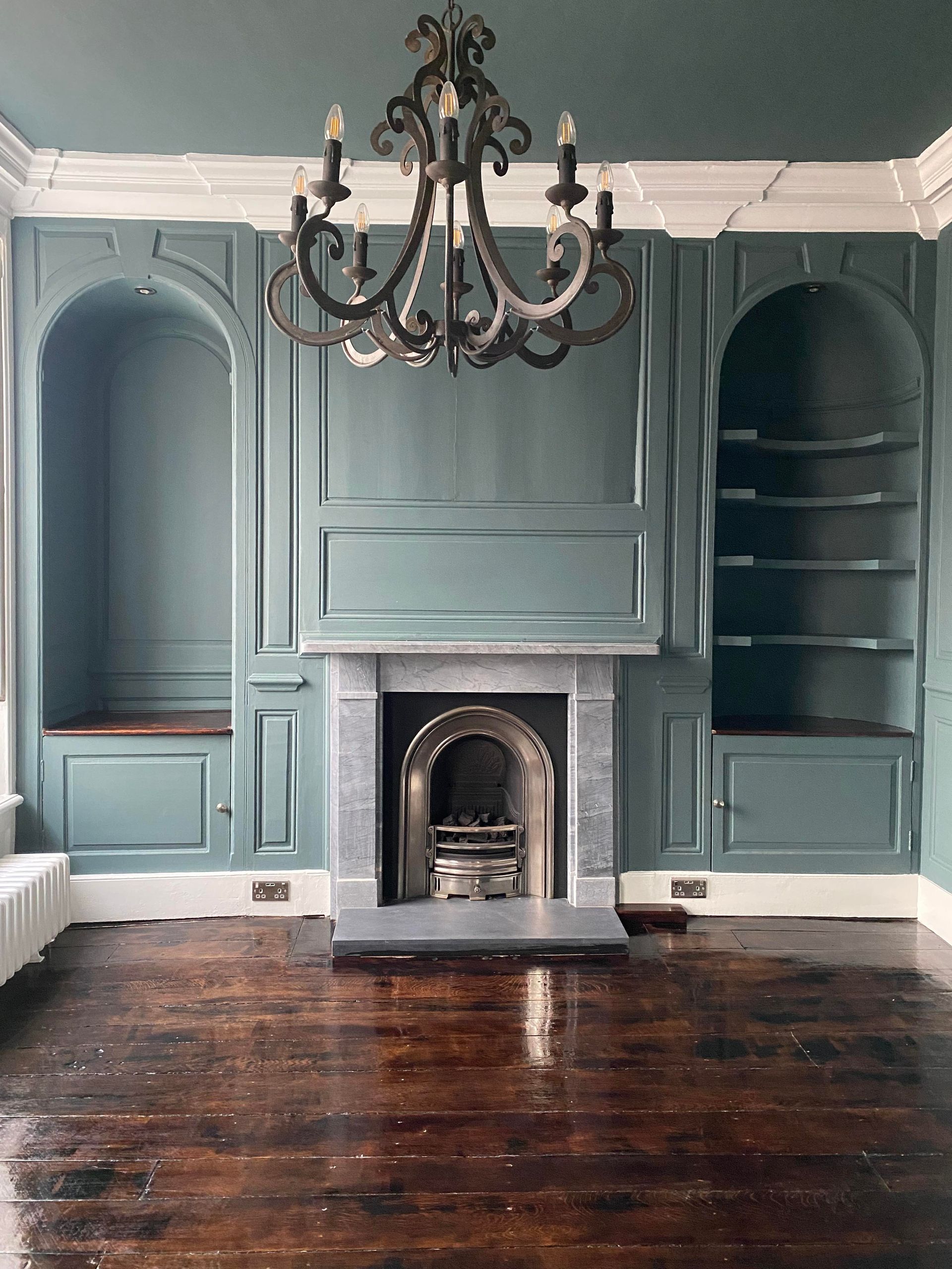 Deep cleaned living room with painted fireplace and built-in shelving – domestic clean in North Shropshire