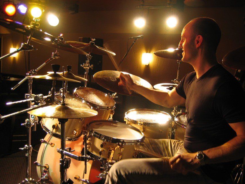 a person learning to play the drums