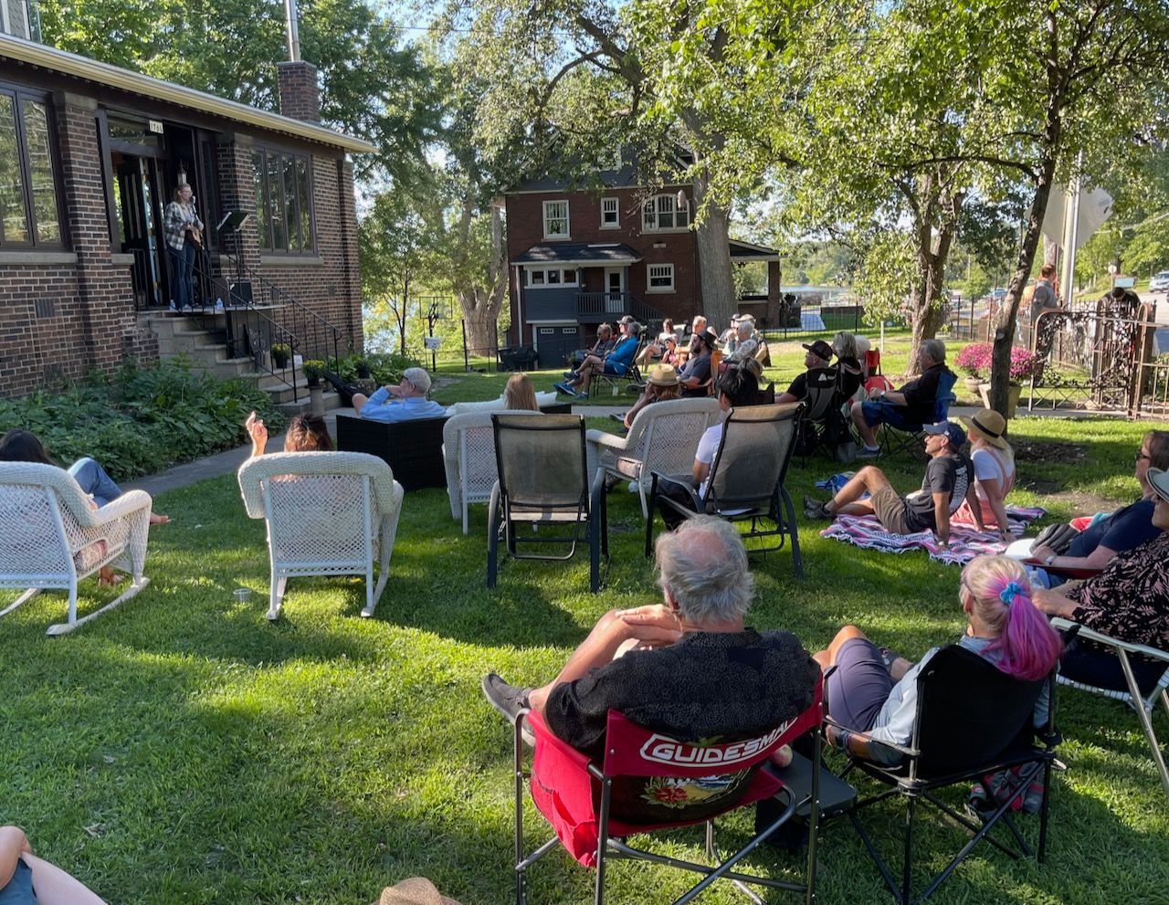 A large crowd listens at PorchFest DSM 2022