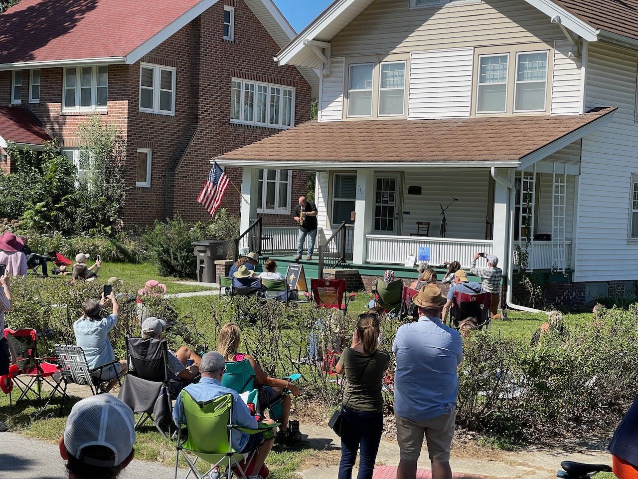 A large crowd listens at PorchFest DSM 2022