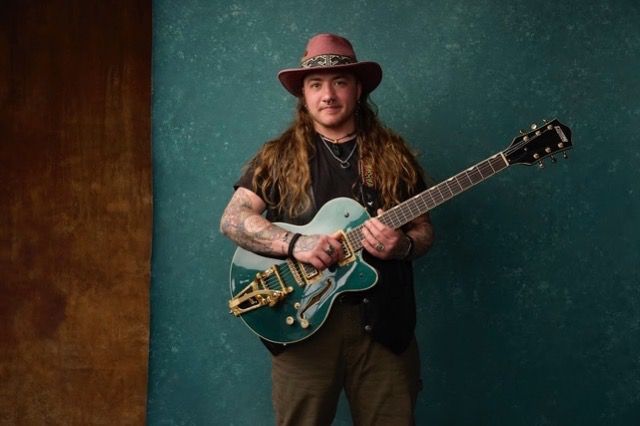 Evander Ellsbury posing with his guitar