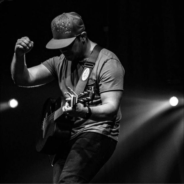 Zachary Freedom powerfully riffs his guitar