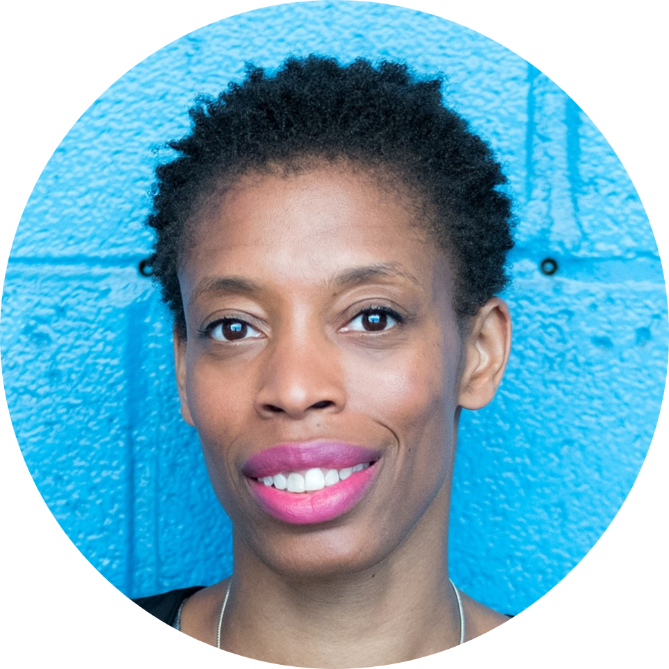 Headshot photo of Alison against a blue background