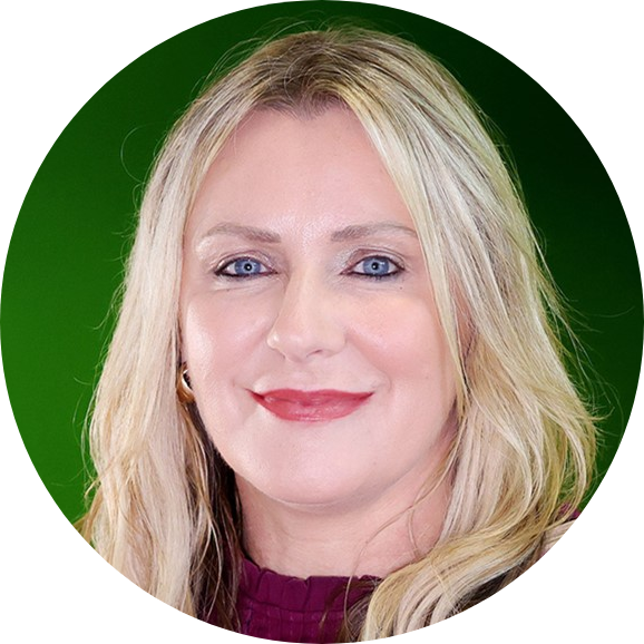 Headshot of Arlene smiling, green background.