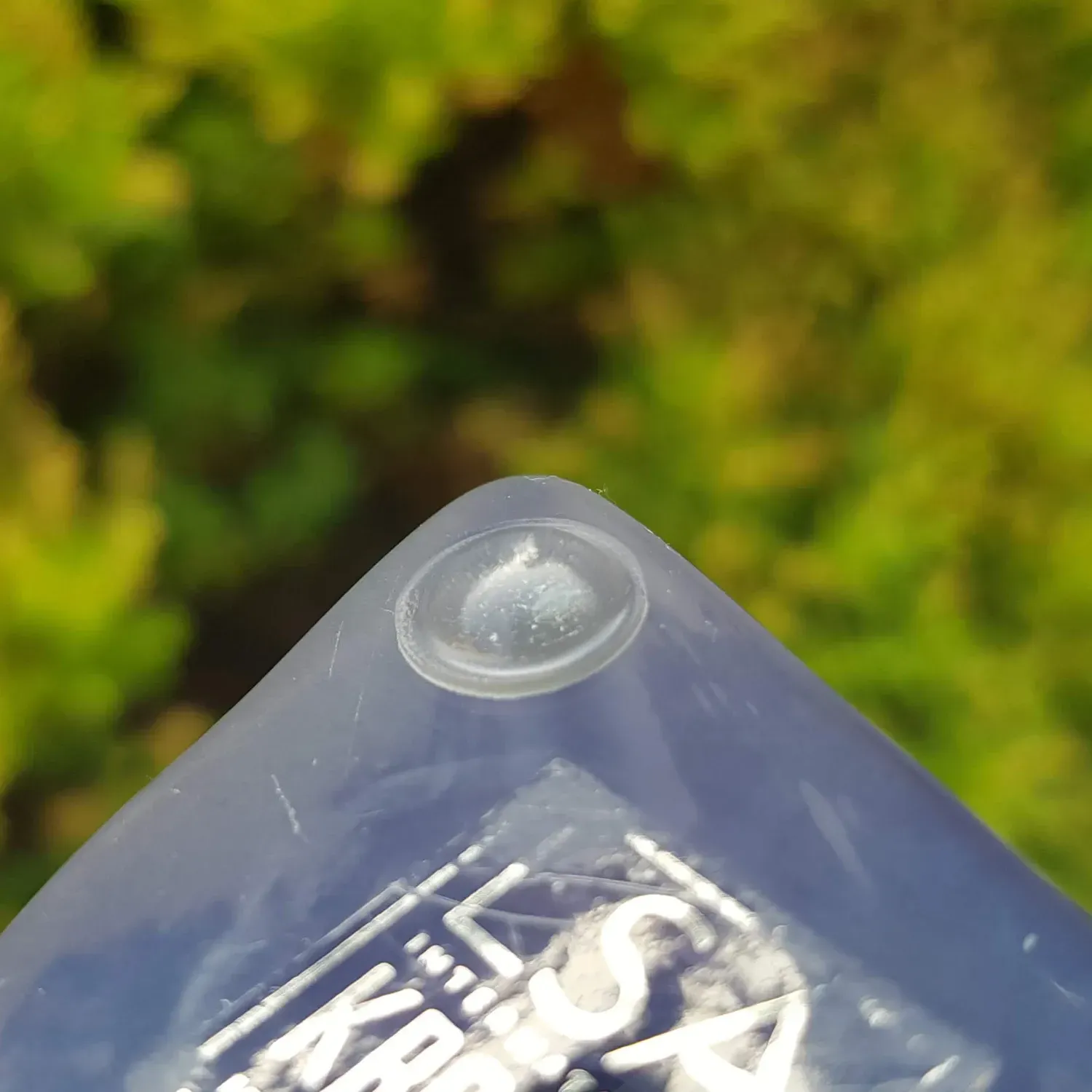 Domed rubber pad affixed to the base of a handmade glass item