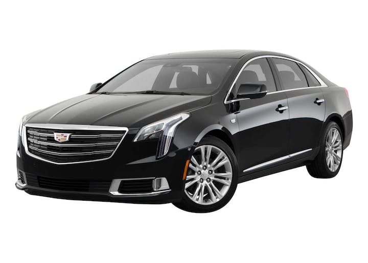 Black Cadillac XTS executive luxury sedan exterior.
