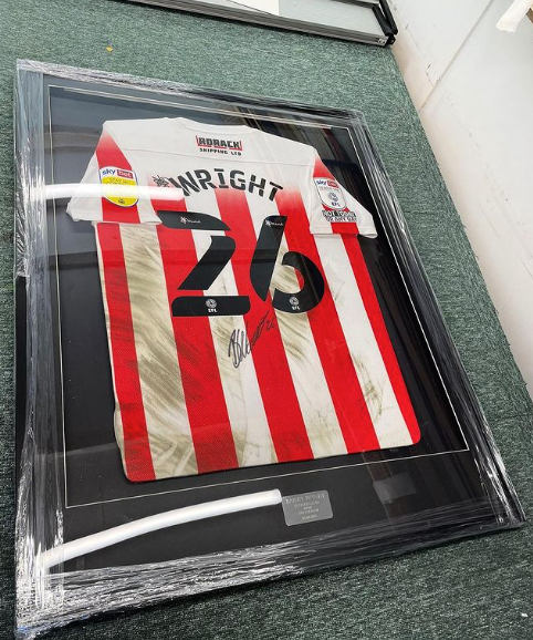 A framed Sunderland football shirt