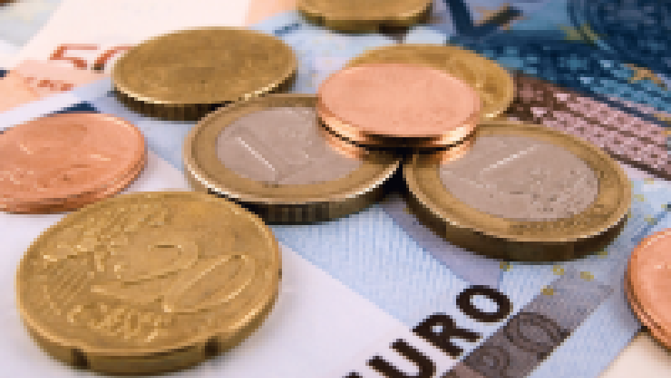 Coins on table, which must be returned because they were collected for social services not due.