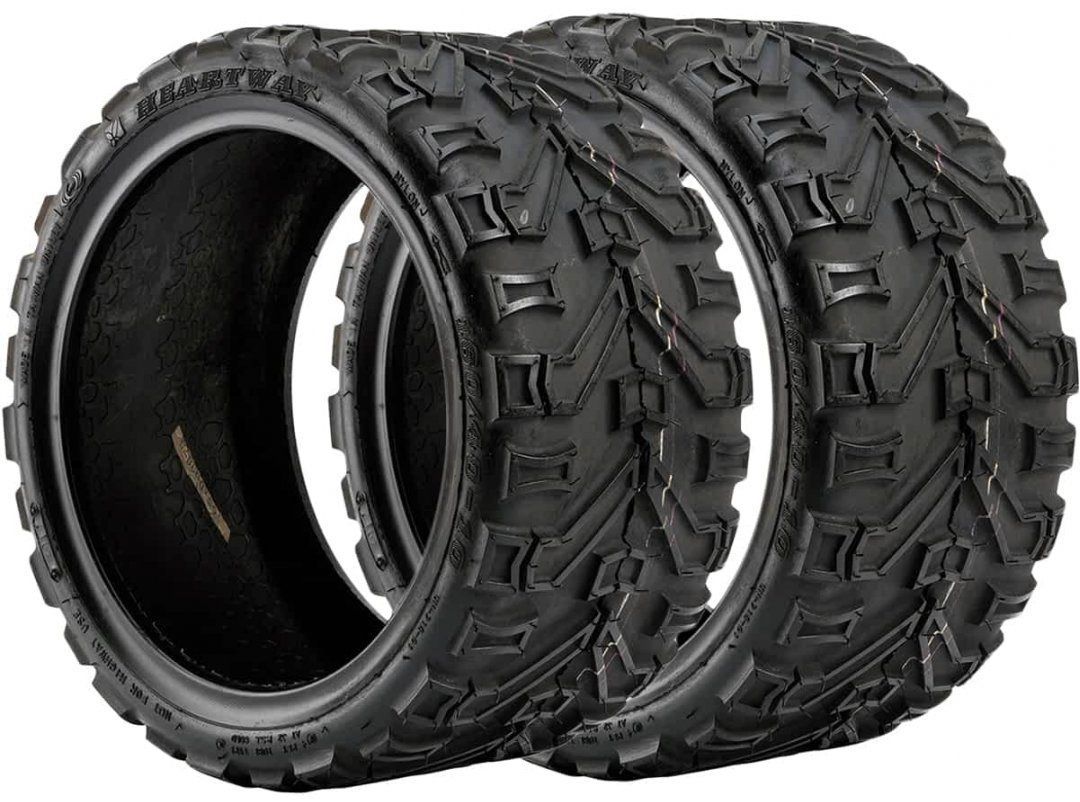 Paire de pneus tout-terrain Heartway à crampons pour fauteuil roulant électrique ou quad, offrant une excellente adhérence sur sols accidentés