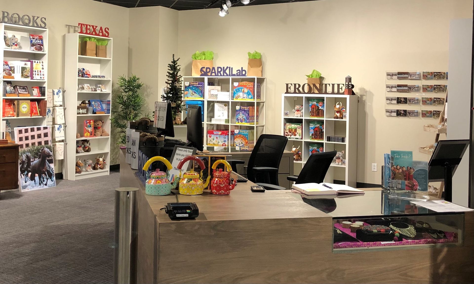 Irving Archives and Museum store interior with decorative teapots, bookshelves, and various retail items.