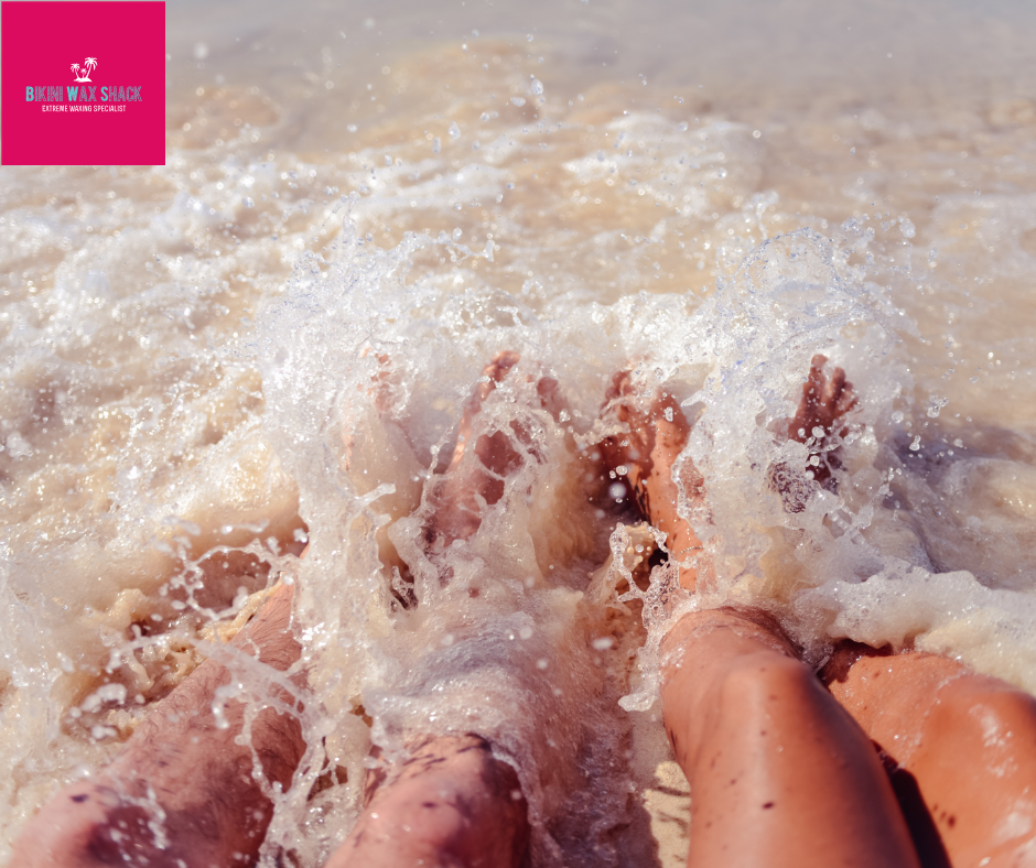 Bikini Wax Shack feet in the sea