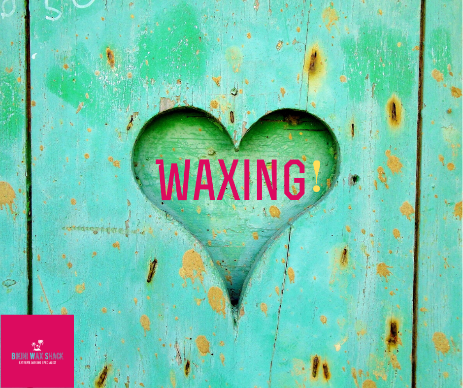 Heart carved into wooden distressed plank.