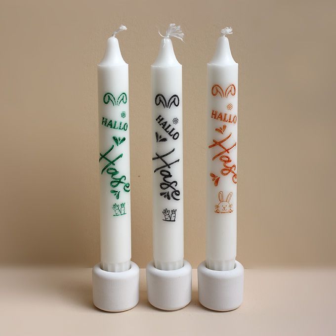 Drei Stabkerzen mit der Aufschrift