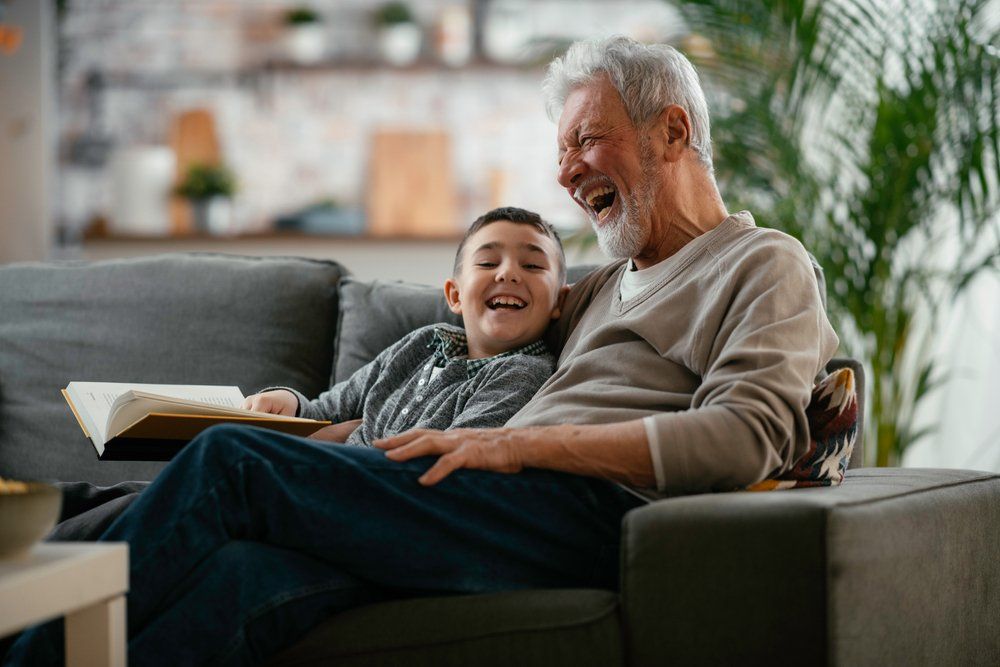 Grandfather laughing with grandson