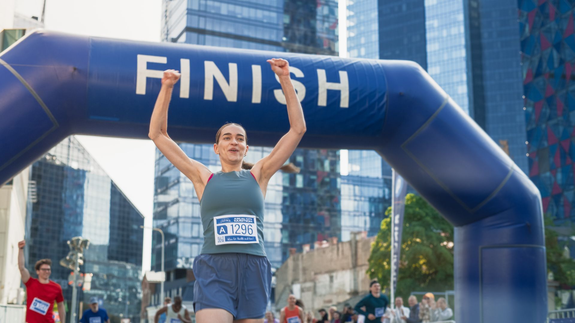 Female athlete crossing the finish line of a race