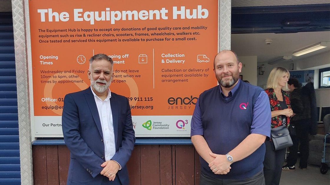 Two man standing in front of an information board