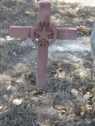 stone cross marking the grave of a Texas Ranger