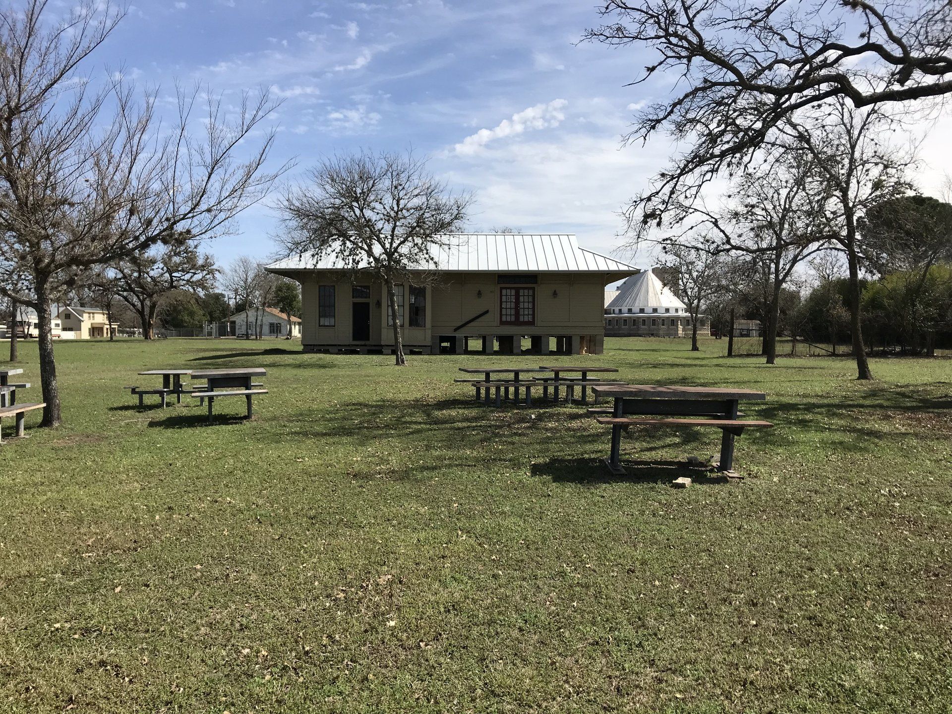 Heritage park at 401 FM 480 in Center Point Center Point Heritage Park with tables and old train depot in back