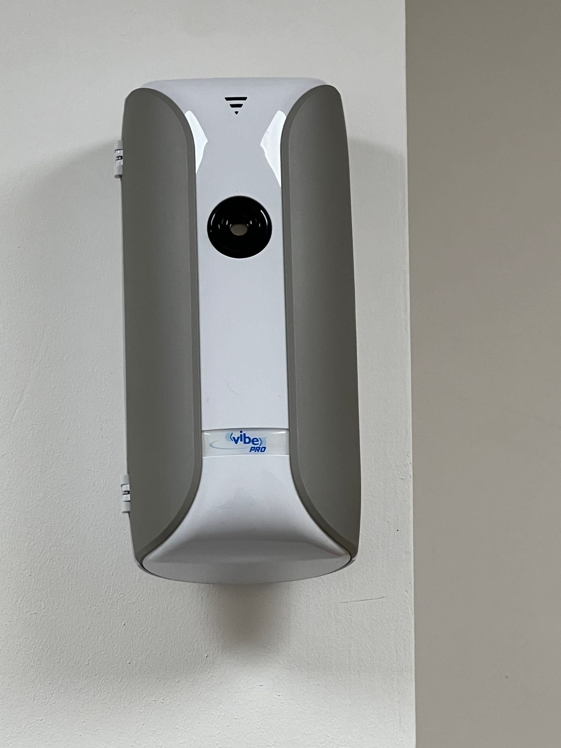 A picture of a very modern sleek well designed air freshener showing the need to connect services.