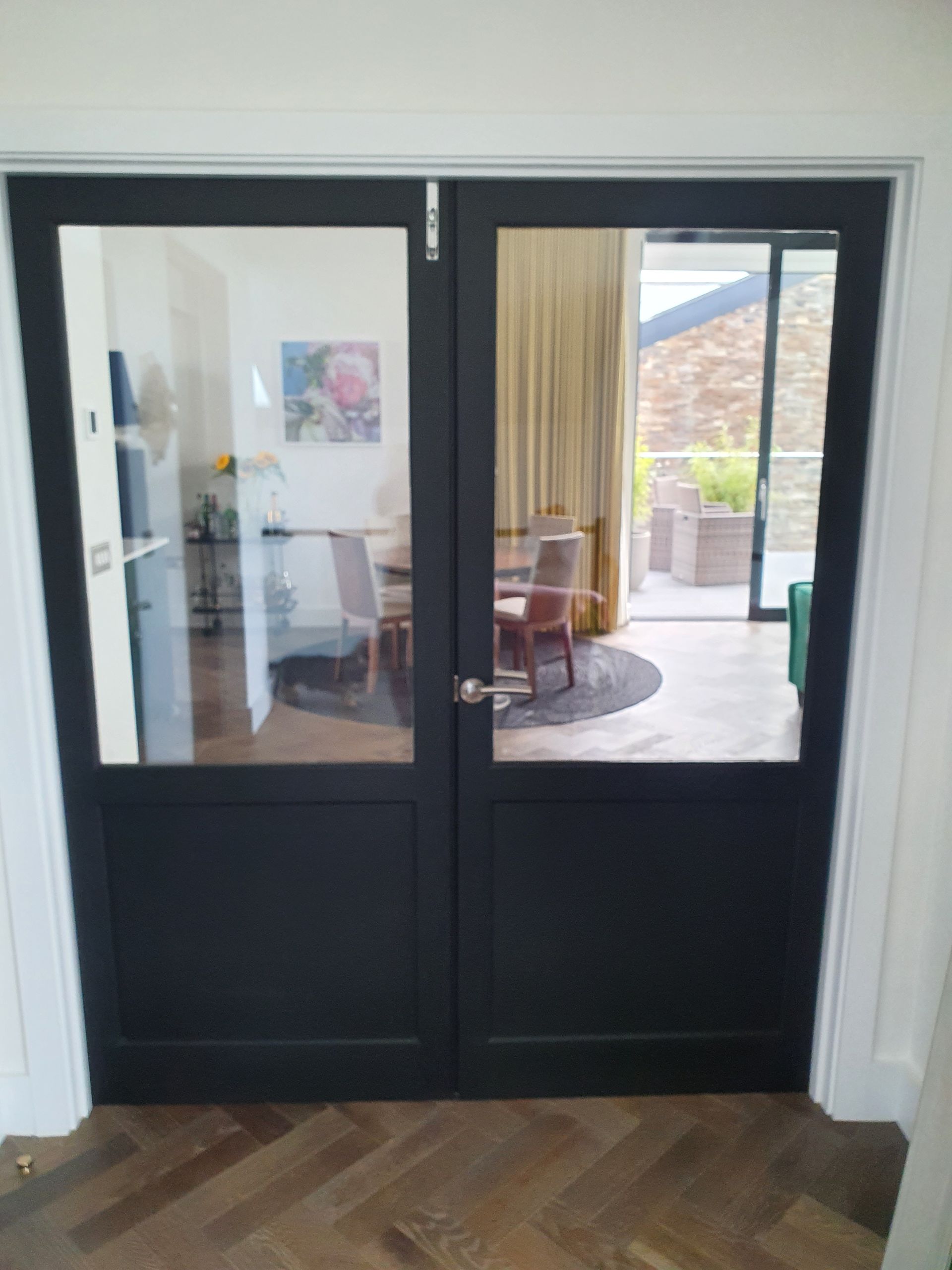 European prime oak doors with flat panel and double glazed top ebonised with Indian Ink 