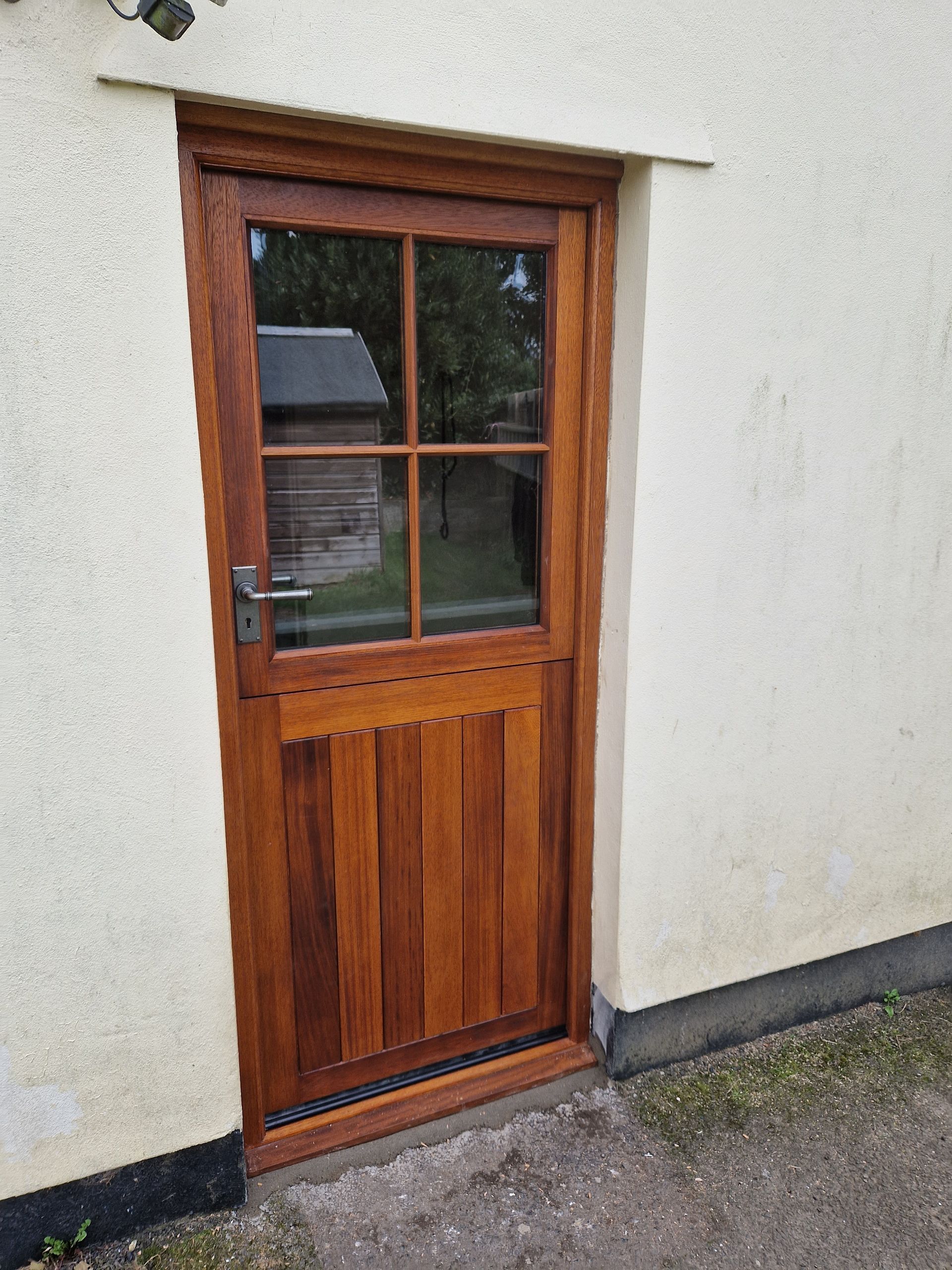 Iroko stable door and frame with double glazed duplex top section and double TGV and insulated bottom