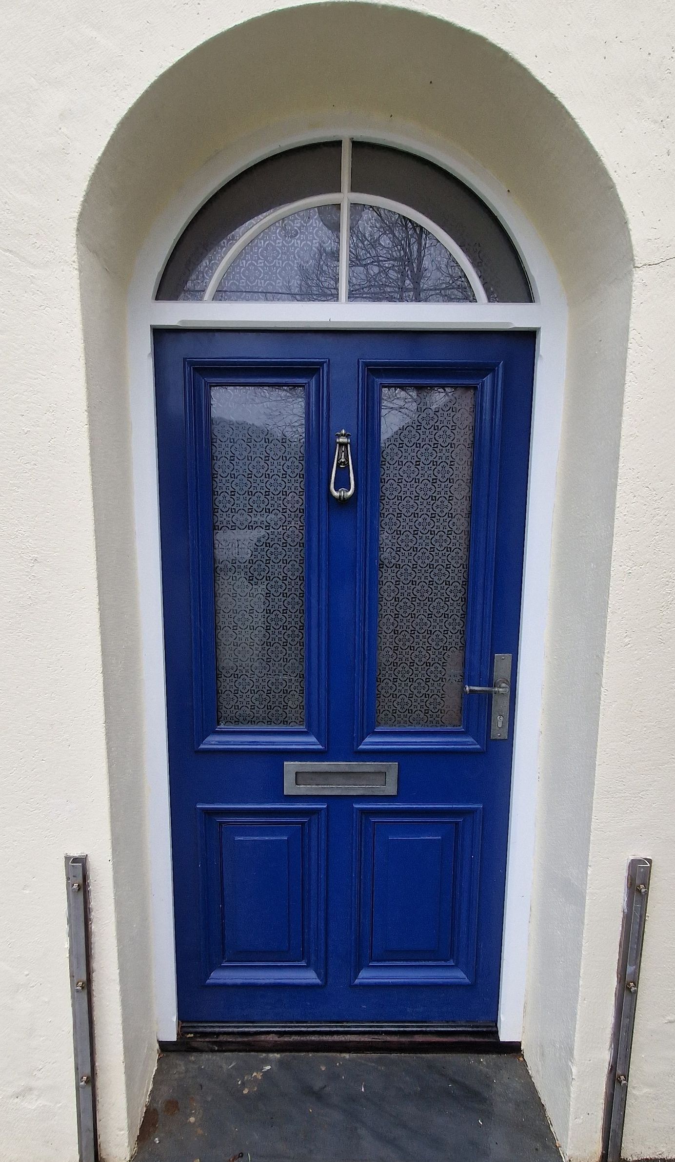 Accoya door with arched frame, raised bolection mouldings and glazed with Pilkington canterbury glass with curved duplex