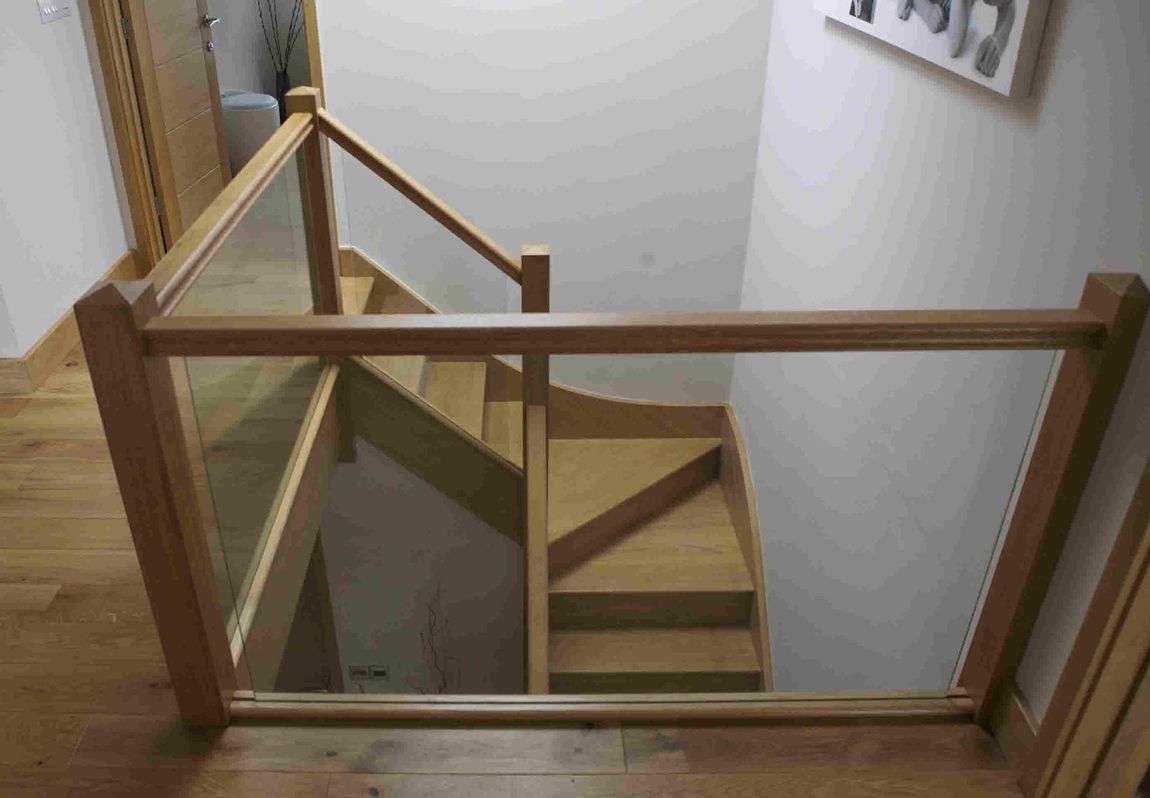 Bespoke Oak staircase with glass balustrade