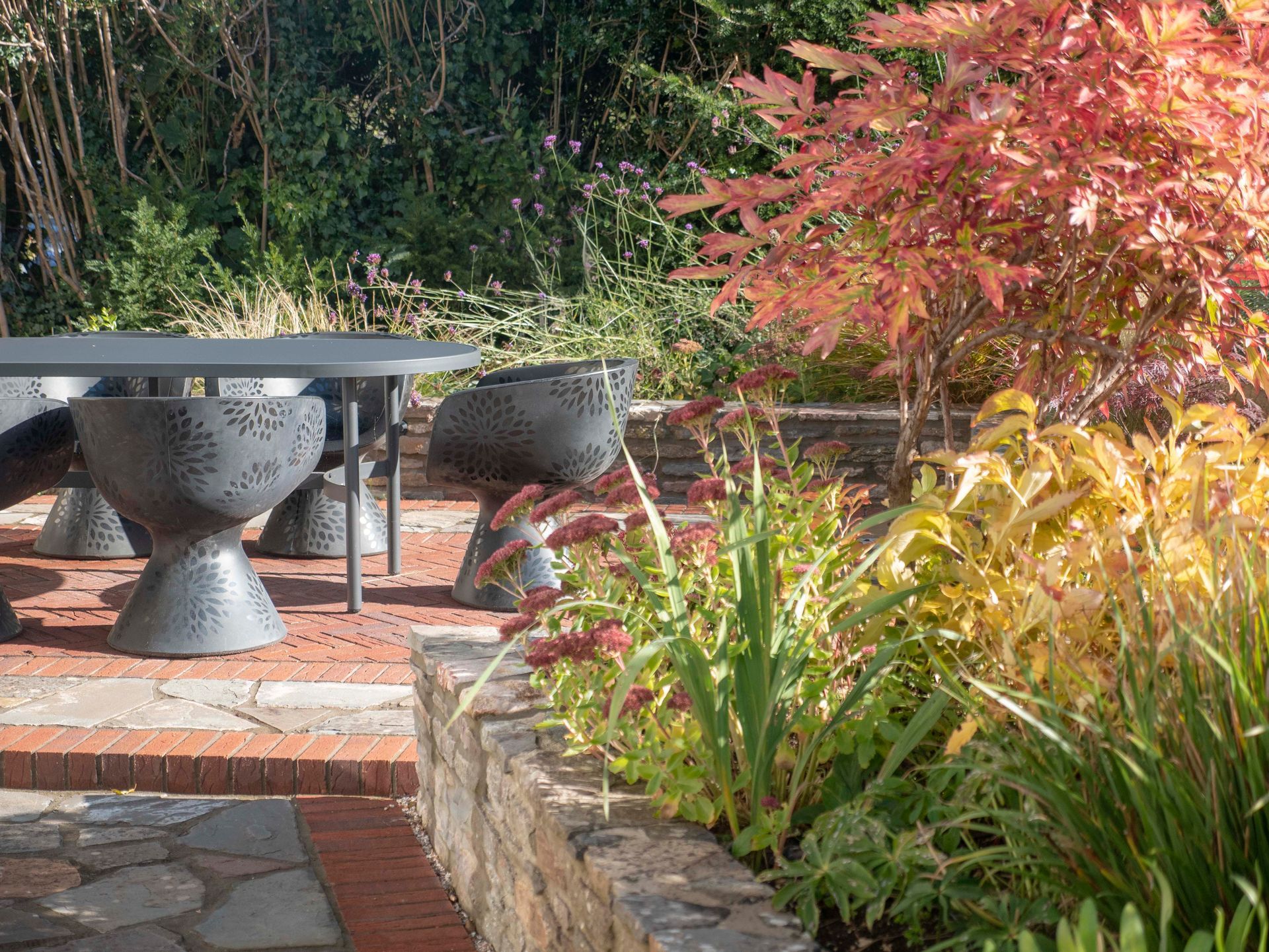 Front garden terrace with autumn planting