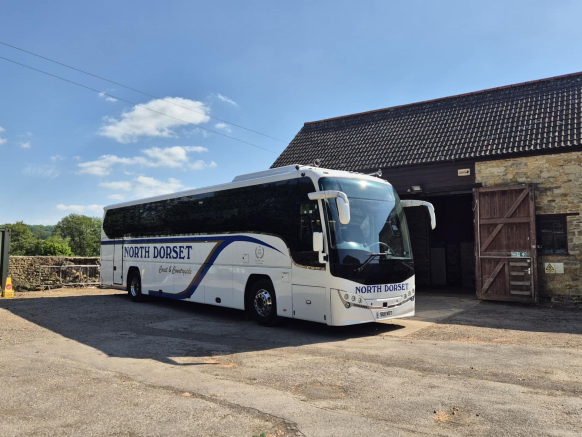 Coach outside barn