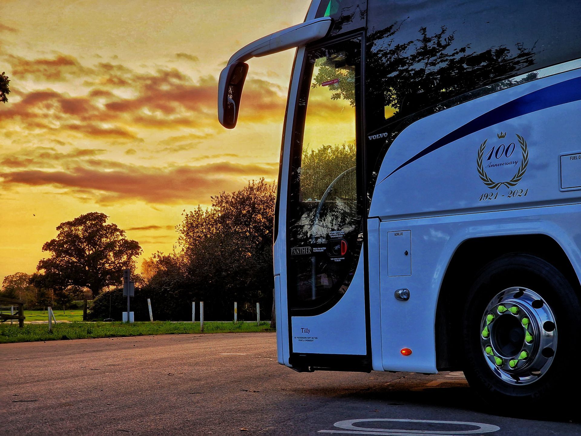Coach facing the sunset