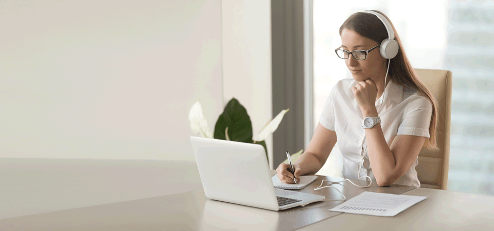 Woman taking an online course at home