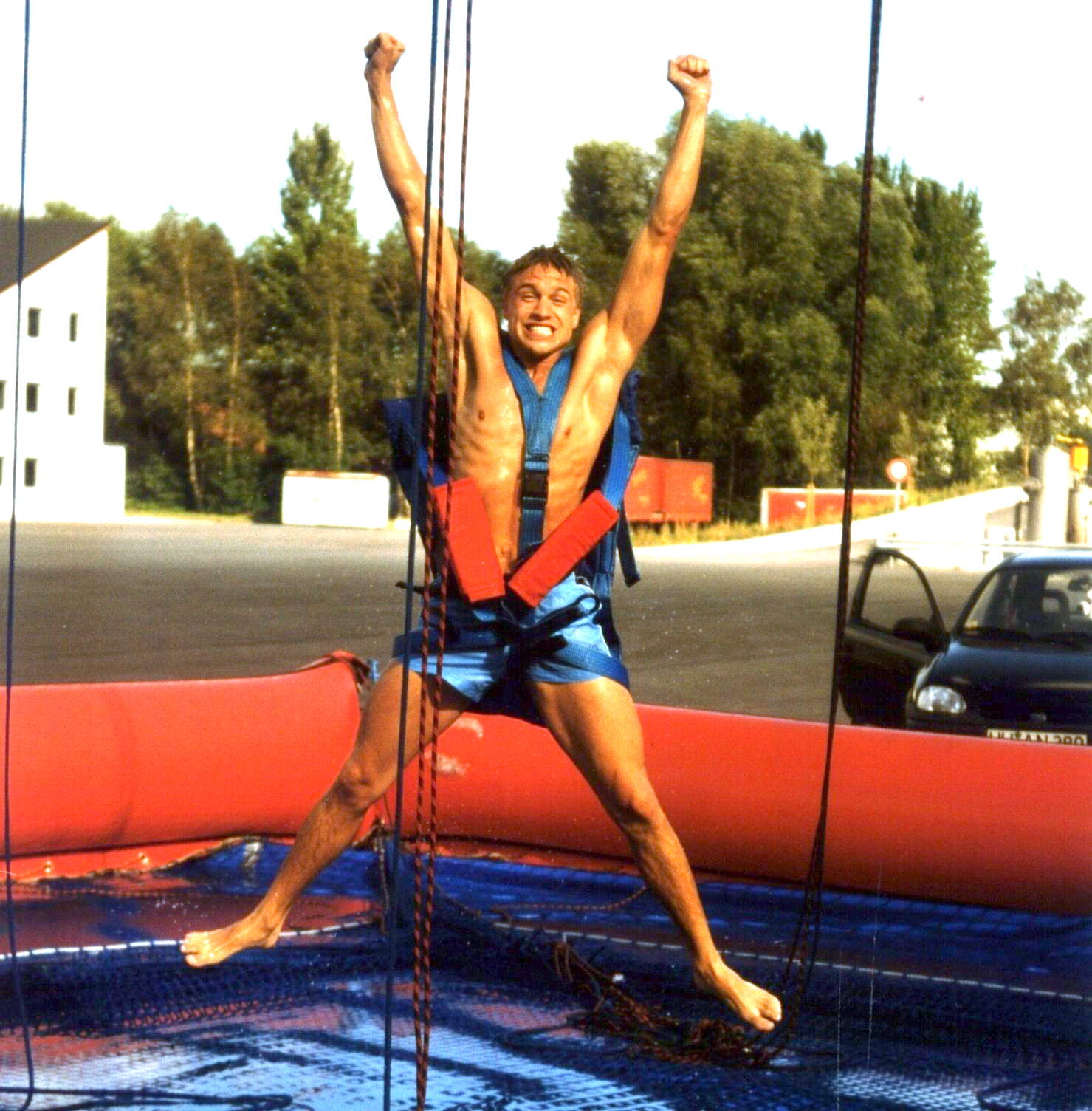 Guy jumping after free fall in board shorts