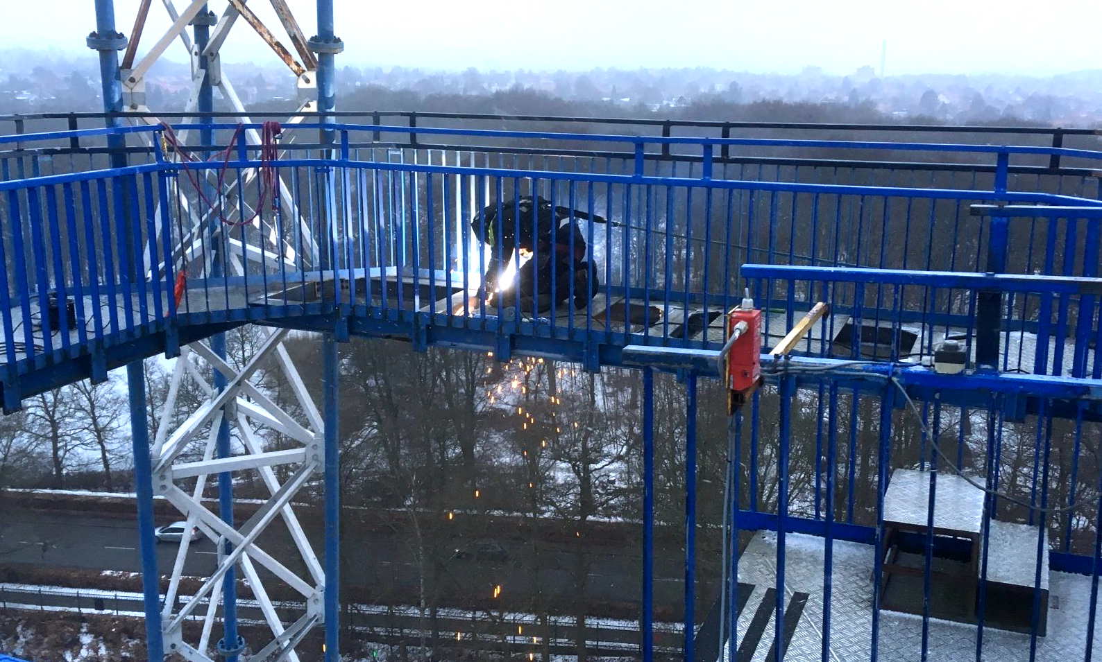 Welder on free fall tower