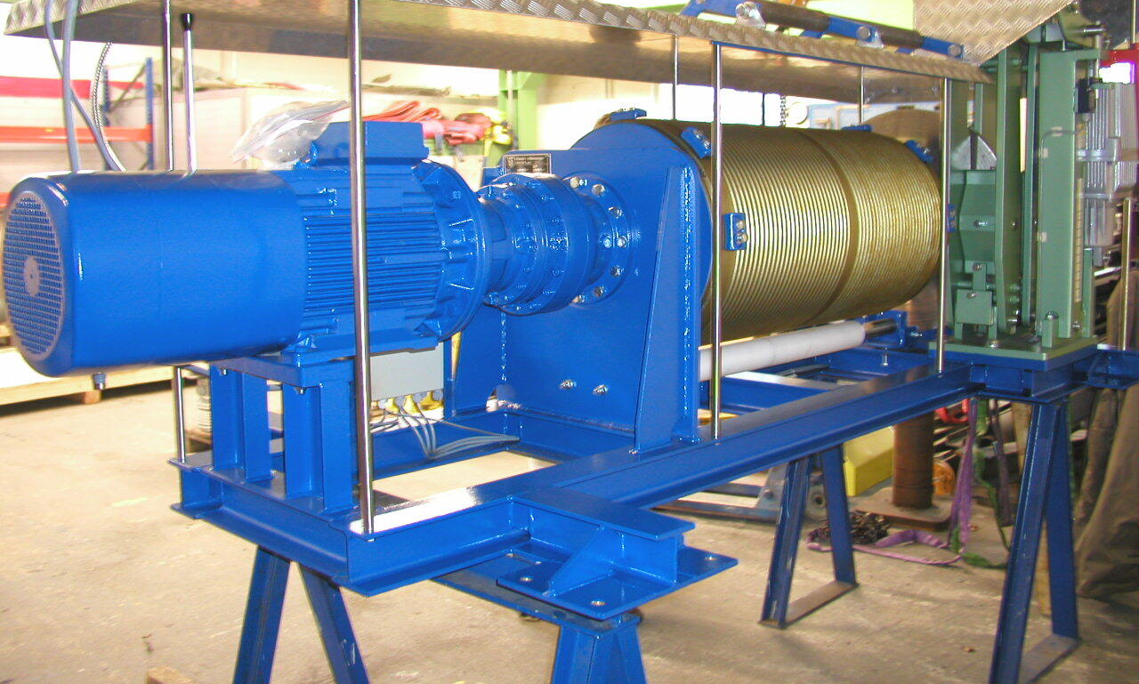 Electric winch for amusement ride