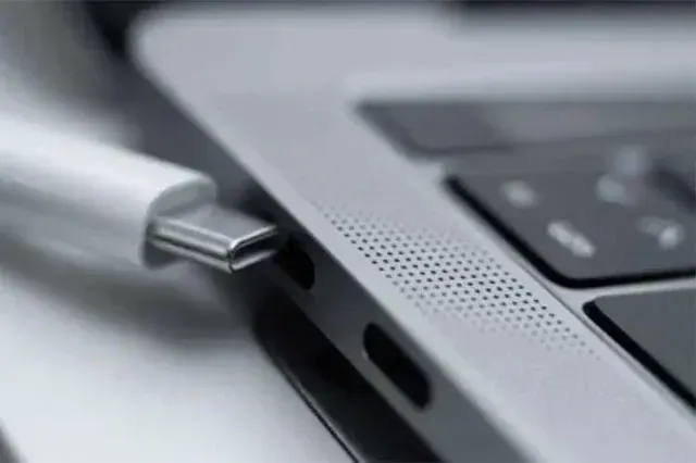 MacBook charger port repair in progress at London shop