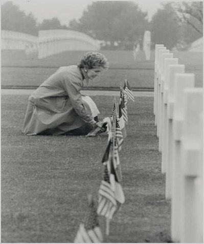 Nancy Reagon 1984 laying flower at the grave of Liz Richardson
