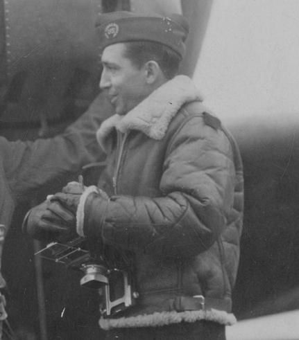 War Photographer Bede Irvin entering an American two-engine bomber of the 9th Air Force