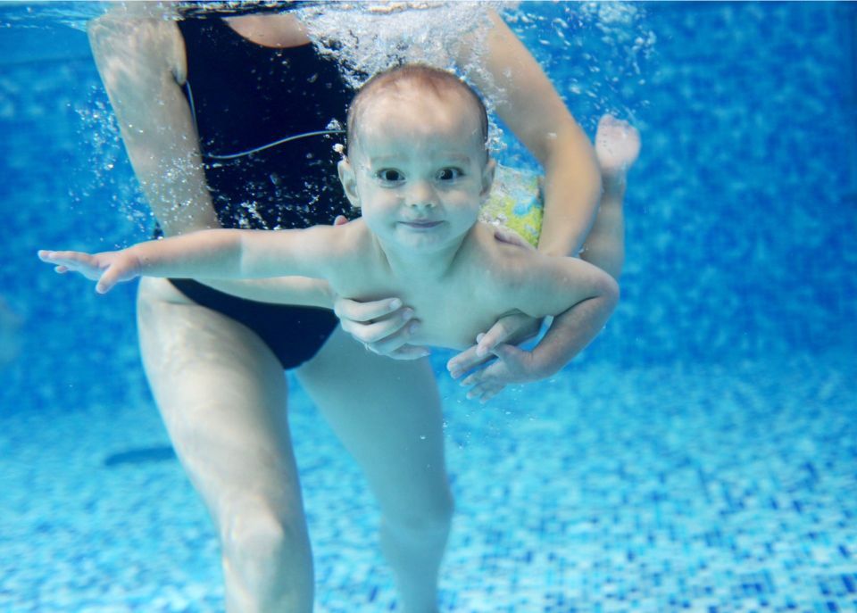 Young child swimming