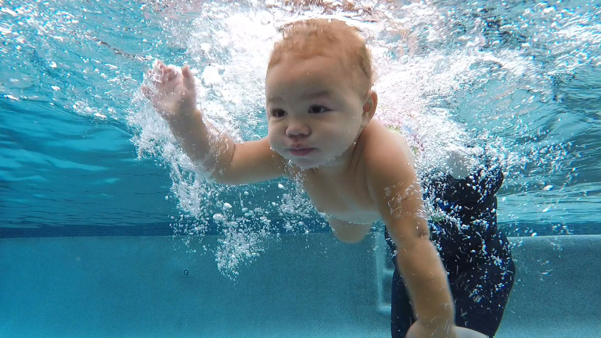 Young child swimming