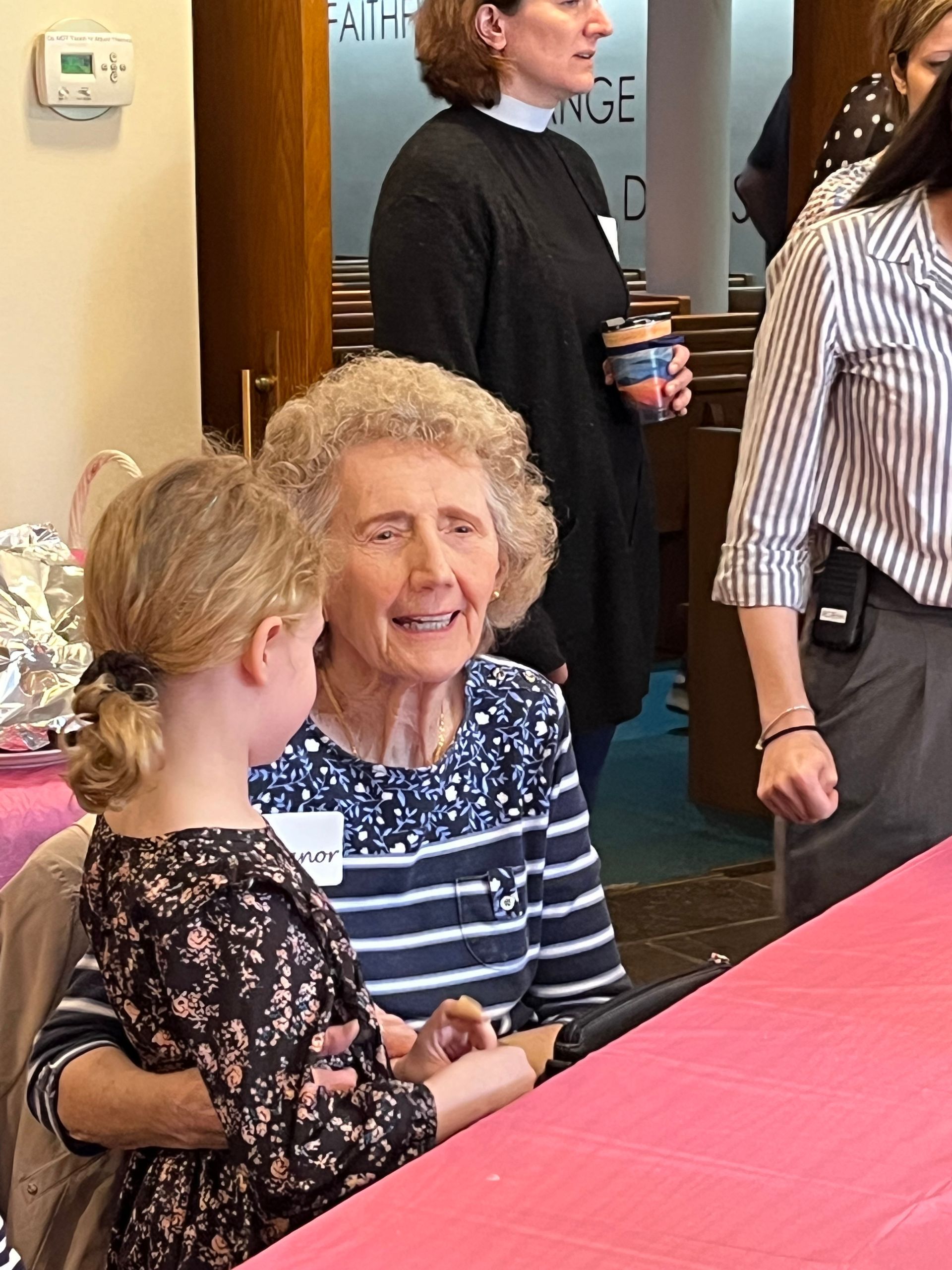 members of the congregation spending social time with the children of calvary's nursery school and child care.