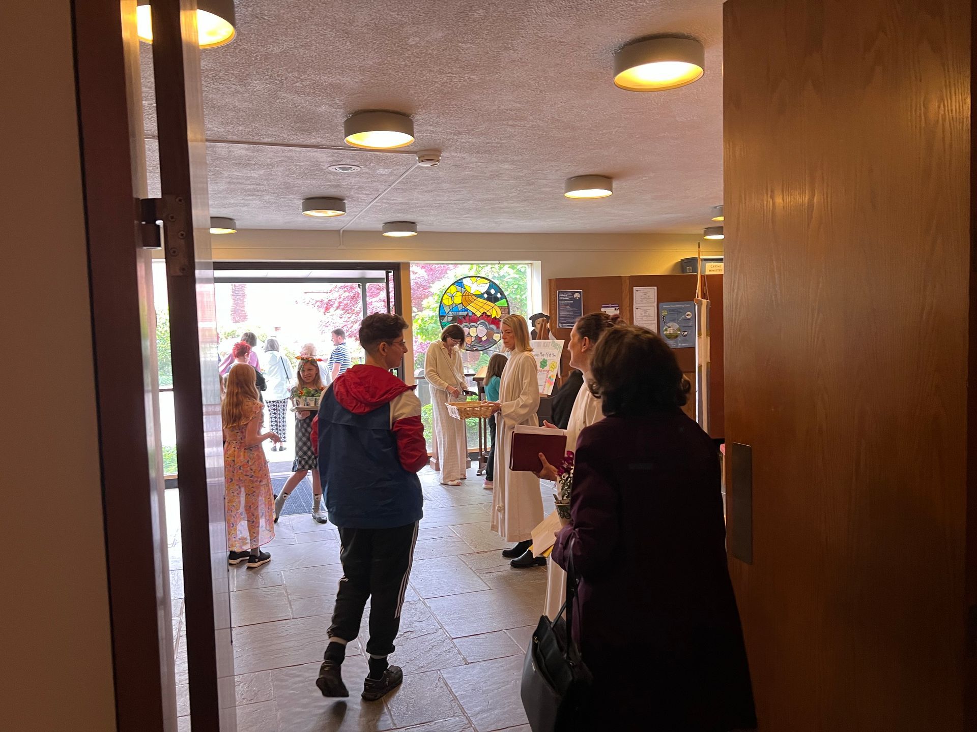 Pastor greeting people as they leave the sanctuary after worship
