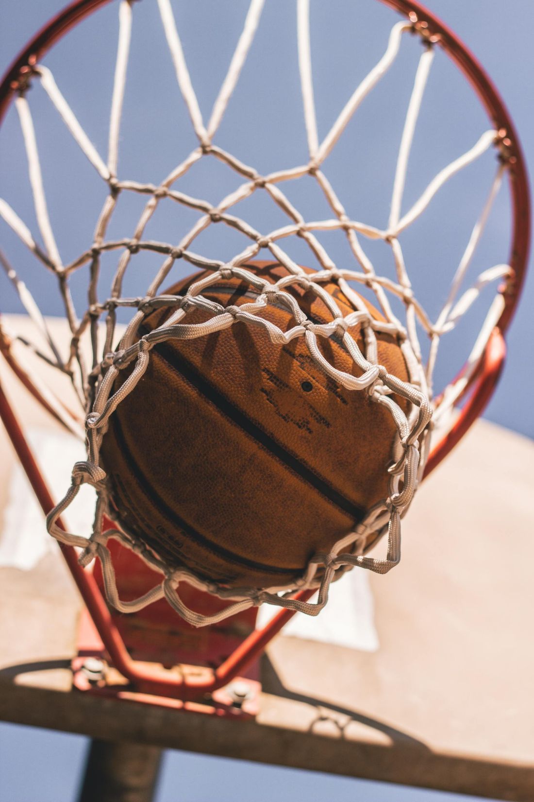 a basketball going through a hoop