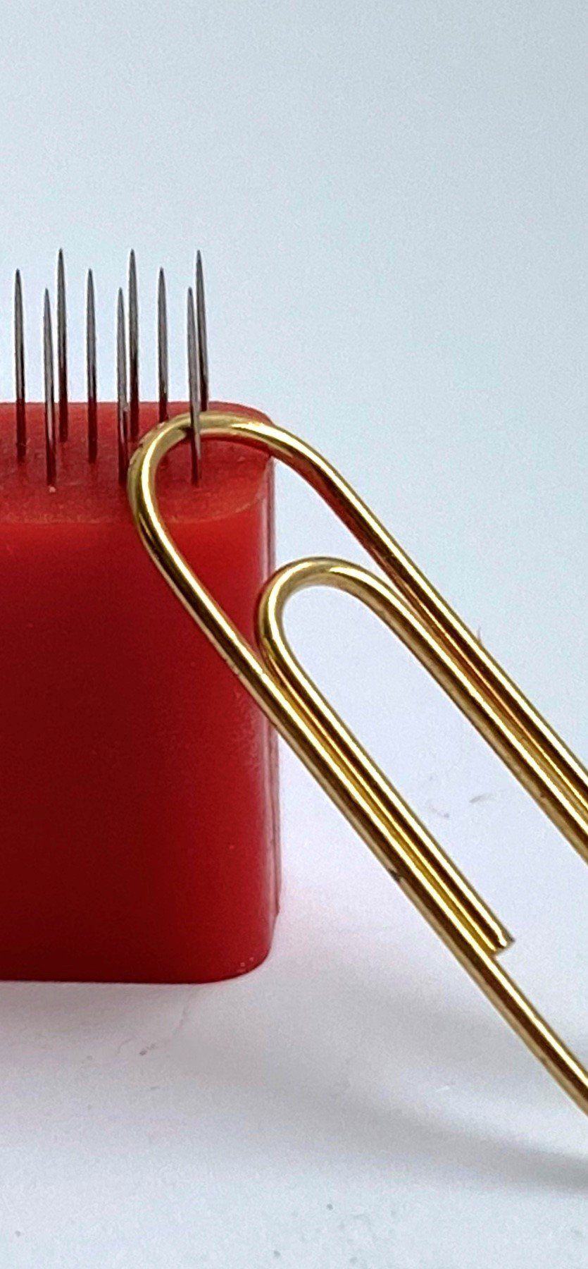 0.25mm diameter needles in perforating component, pinned product