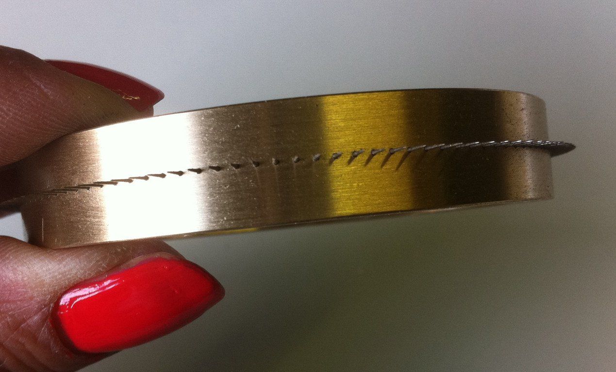 Single row perforating slitter