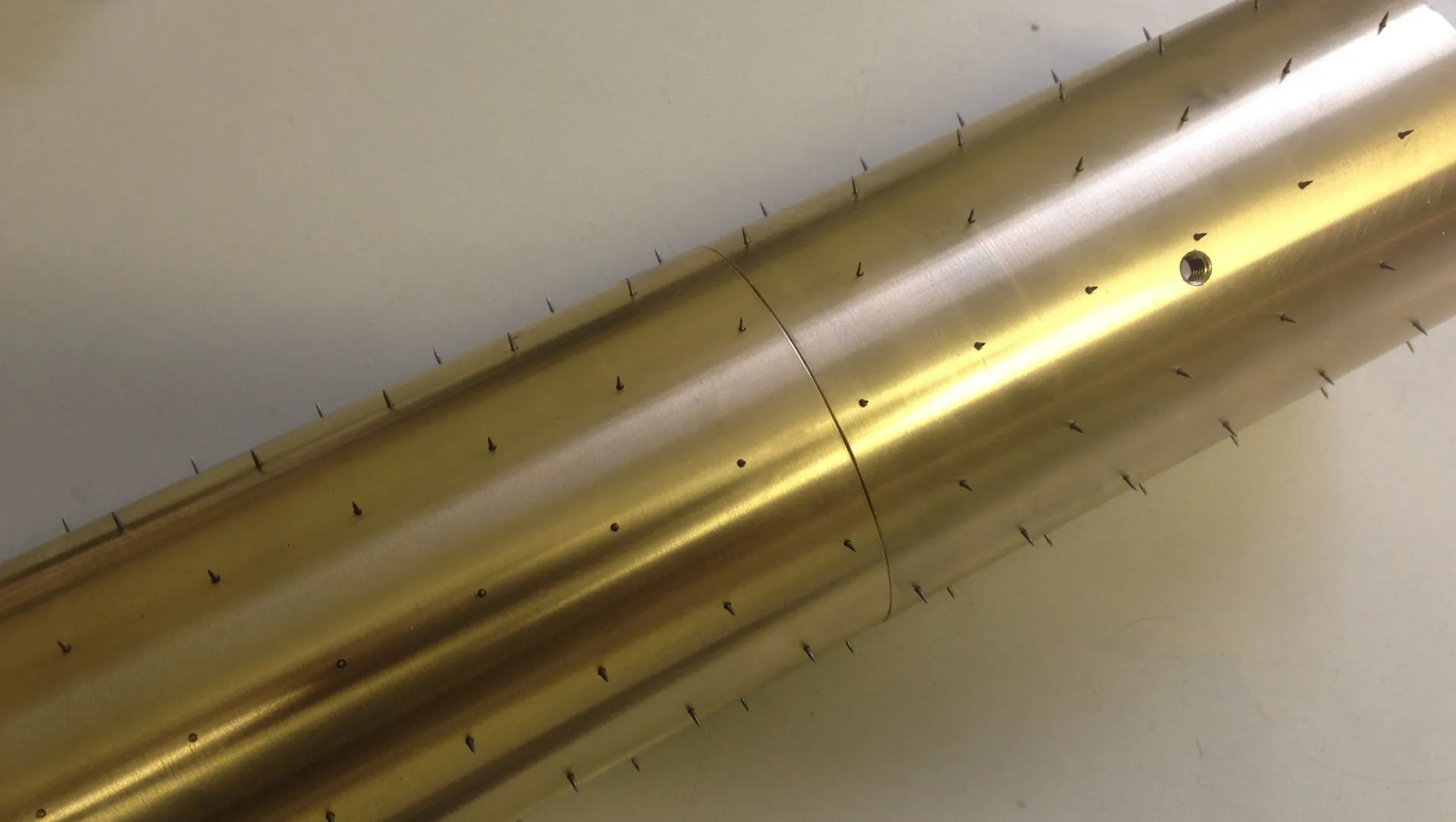 Interlocking spiked rollers, interlocking pinned perforating segments