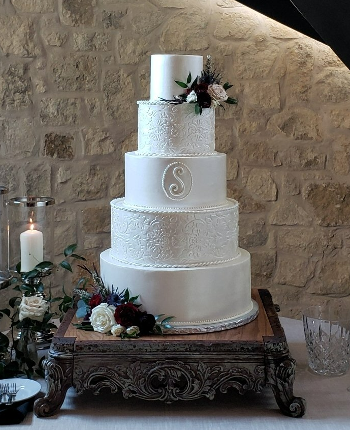 5 tier, fondant wedding cake with tooled leather details